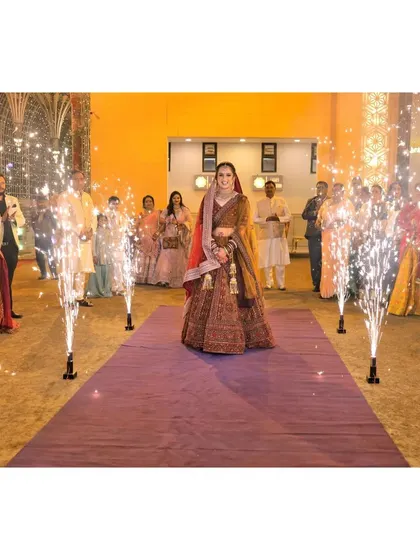 The bride's solo entrance, with sparklers lighting up her path.