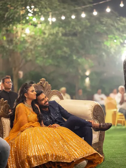 A quiet moment amidst the celebration. I ensure there are comfortable and elegant seating areas for the couple to relax and soak in the atmosphere of their Sangeet night.
