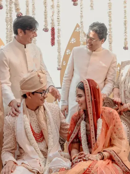 A happy family portrait from an intimate wedding ceremony, capturing three generations of smiles and blessings.