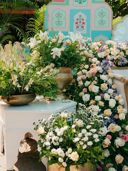 A close-up of the pastel floral arrangements used to decorate the Mehendi stage.