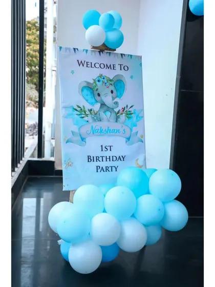 A welcome sign for a baby elephant themed first birthday party.