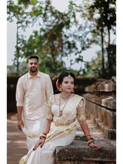 A stylish portrait of a couple at their traditional wedding venue.
