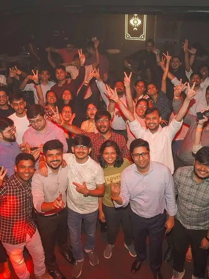 A group shot of the entire floor with hands in the air at Toca Brigade. This shows my ability to unite a large crowd and create a collective feeling of celebration.