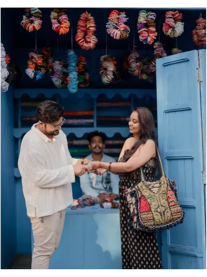 A unique pre-wedding shot showing the couple interacting with a local shopkeeper, adding an authentic and story-driven element to their album.