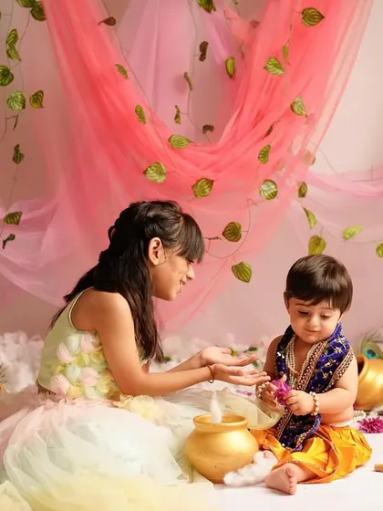 A quiet, interactive moment from our Krishna and Radha themed session. The beautiful costumes and detailed Vrindavan-inspired set bring this divine story to life.