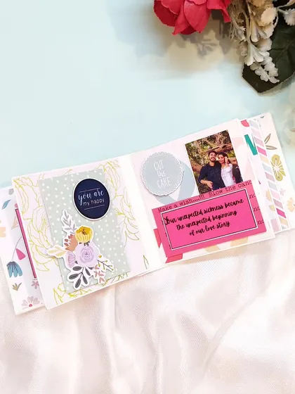 An inside page of a mini scrapbook, showing how I combine photos with messages and embellishments.