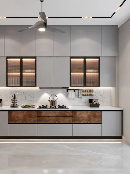 Another angle of the Amaryllis kitchen, showing the combination of solid and glass-front cabinets. The brown accents on the lower shutters add warmth and visual interest to the monochromatic design.