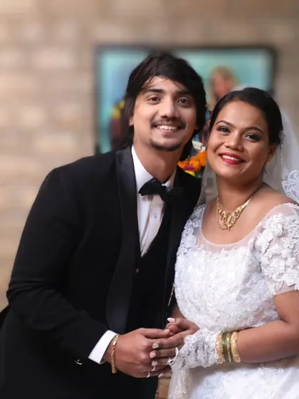 A beautiful couple on their wedding day. I created a classic bridal look for her, with a simple updo, a glowing complexion, and a pop of color on the lips.