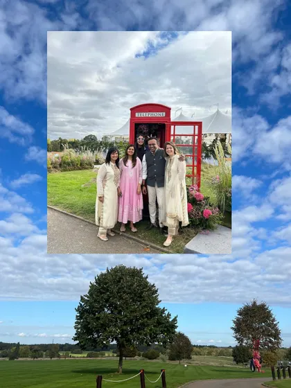 Our founders posing by the iconic red telephone booth we installed for a UK wedding, a fun photo-op for guests.