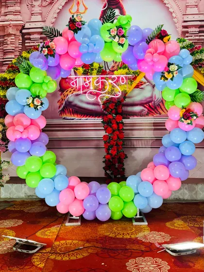 A clear view of the 'Namkaran' neon sign against the colorful balloon backdrop. The sign is bright and serves as a great centerpiece for photos.