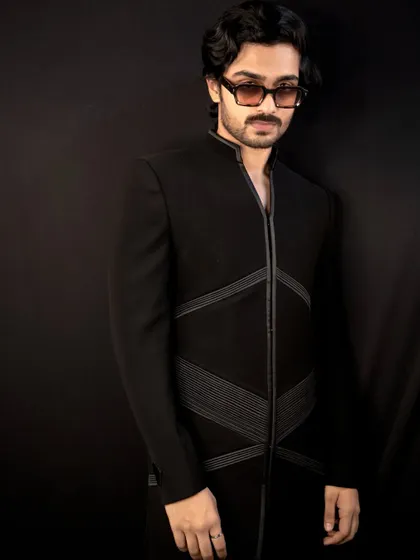 The 'Grooved Lines' jacket, another of my signature designs. This piece features structured, geometric lines on a sharp black Indo-Western silhouette for a modern and edgy look.