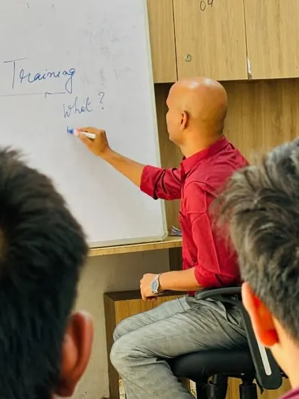 A close up of our coach teaching a mindset class. These sessions are part of our holistic approach, ensuring our athletes are mentally prepared for the pressures of competition and life.