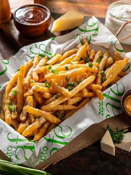 Golden-brown french fries for Zepto Cafe, perfectly seasoned and ready to order. We style comfort food to look its best, ensuring it appears fresh and crispy for customers browsing online.