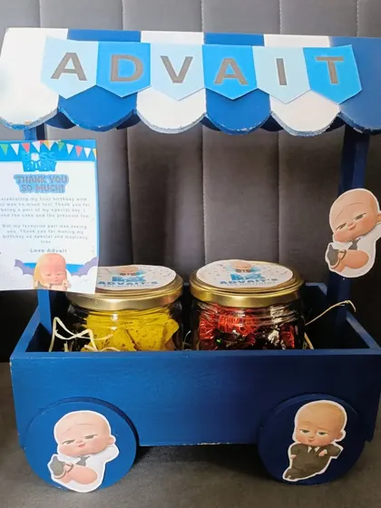 Who's the boss? The birthday boy, of course! I had so much fun creating this 'Boss Baby' themed gift cart, personalized with the birthday boy's name. It shows how I can take any party theme and turn it into a unique and memorable return gift.
