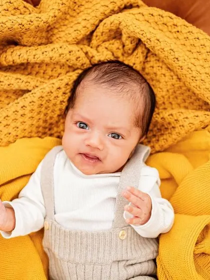 This little one decided to wake up mid-shoot. I love capturing both sleepy and wide-awake expressions during my newborn sessions at home.