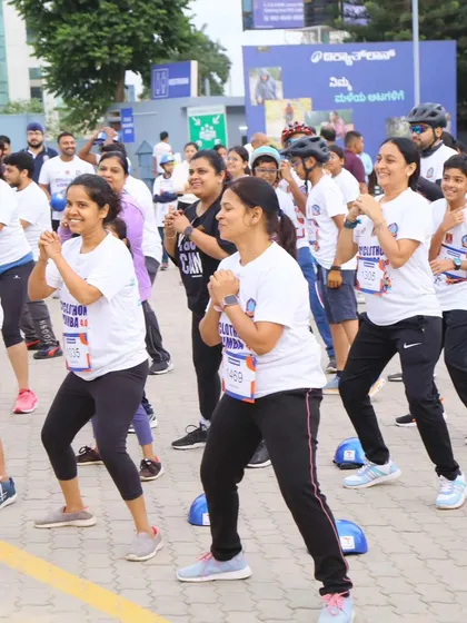 Participants fully engaged in the Zumba warm-up at the Decathlon event. Our routines are designed to be fun and effective for people of all fitness levels.