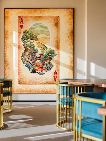 What gives a space its soul? It's the layering of textures, lighting, and art. This corner, with its vibrant artwork and unique cage-like chairs, shows how curated details build warmth, rhythm, and personality.
