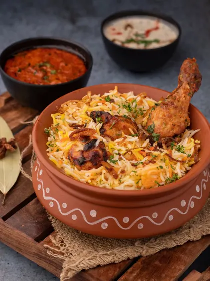 A weekend feast in a bowl. We styled this chicken biryani in a traditional handi to give it an authentic feel, focusing on the rich colors and textures that make it a beloved classic.