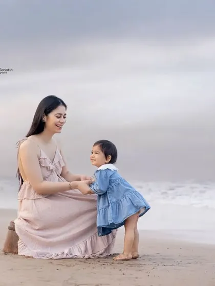 Sweet moments between a mother and her mini-me on the beach. These are the memories that will be cherished for a lifetime.