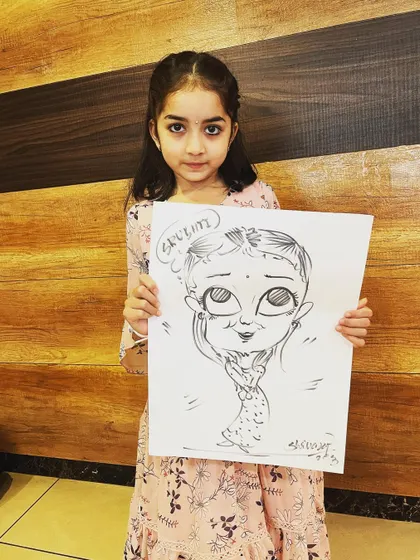 A young girl proudly holding up her finished caricature. I love drawing for kids and capturing their cute expressions in a fun, cartoonish style.