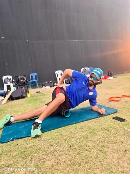 Using a foam roller on the field as part of a cool-down routine. This self-myofascial release technique helps to alleviate muscle tightness, improve flexibility, and accelerate recovery after a tough training session.