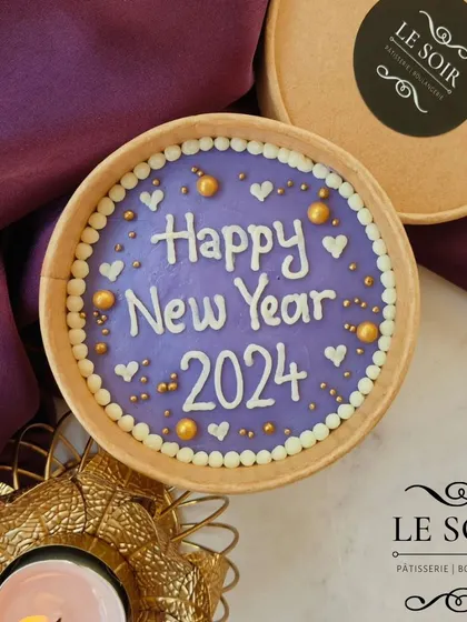 Ringing in the new year with a festive cake tub. This purple tub is decorated with "Happy New Year 2024" in white, with gold and white heart sprinkles.