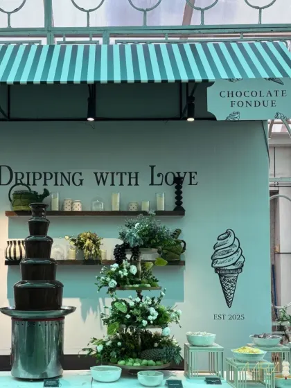 A custom 'Chocolate Fondue' station, designed to be 'Dripping With Love'. This sweet corner was a delightful part of the 'Borough Bazaar' experience, adding a touch of interactive fun for guests.