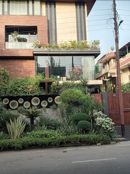 This residential project in Noida showcases my passion for dense, layered planting. I used a rich variety of shrubs, topiaries, and ground cover to create a mature, textured garden that offers visual interest from every angle.