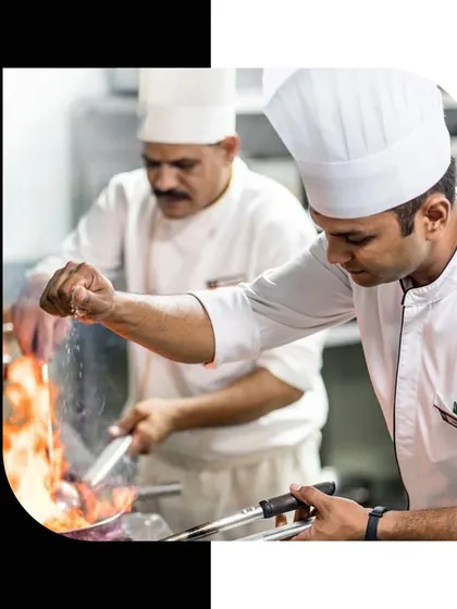 From the sizzle of the pan to the final plating, our chefs choreograph a symphony of taste. This image captures the dynamic environment of our event kitchens.