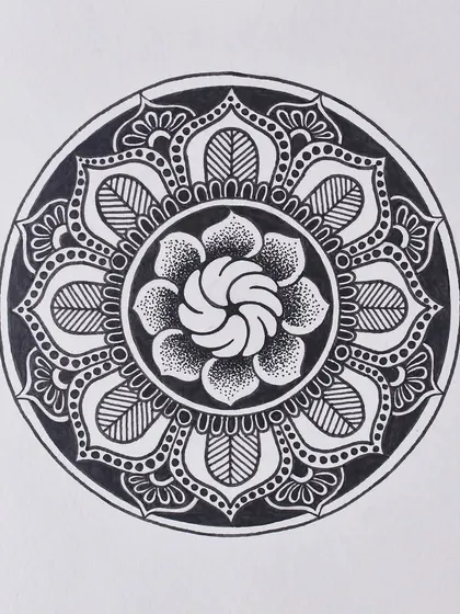 A floral mandala design from my Inktober series. This piece combines line work and dot work to create different textures within the petals.