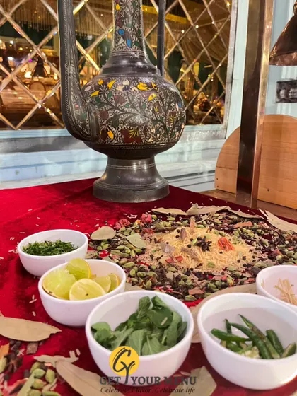 A display of the whole spices and fresh herbs that form the soul of our cooking, beautifully arranged as part of the buffet decor.