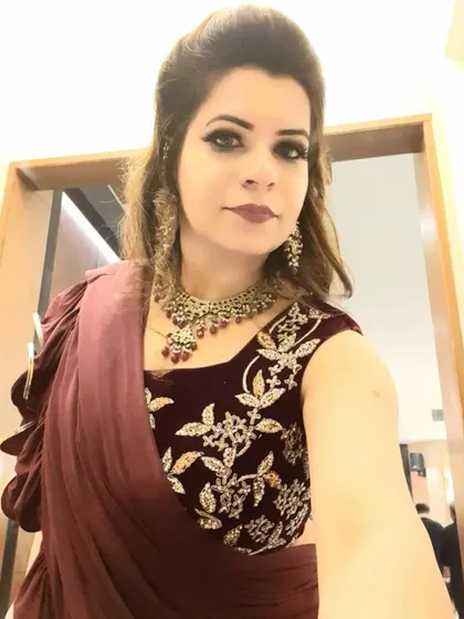 This client wanted a bold look for an evening reception. We went with a deep, smokey cat-eye and a rich berry lip color that matched the tones in her embroidered blouse.
