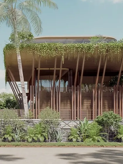 The Sanctuary is a wellness space in Hyderabad designed as a sustainable, lightweight pavilion. The facade is defined by structural timber posts and a delicate screen of wooden fins, with a roofline draped in hanging greenery.
