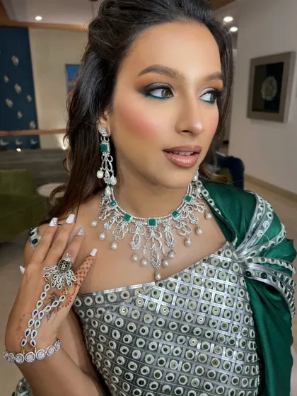 This look was pure art. We created a modern, high-fashion statement with a bold green-touched gaze to complement her couture gown. It’s a perfect example of how makeup can be both loud and graceful.