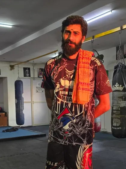 A moment of focus in the gym after a hard training session. The discipline of a fighter is a 24/7 commitment.