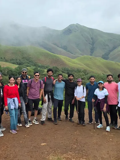 A moment of achievement for our trekking group at Kudremukha. The rolling green hills provide a stunning backdrop for making new friends and unforgettable memories on this classic Karnataka trek.