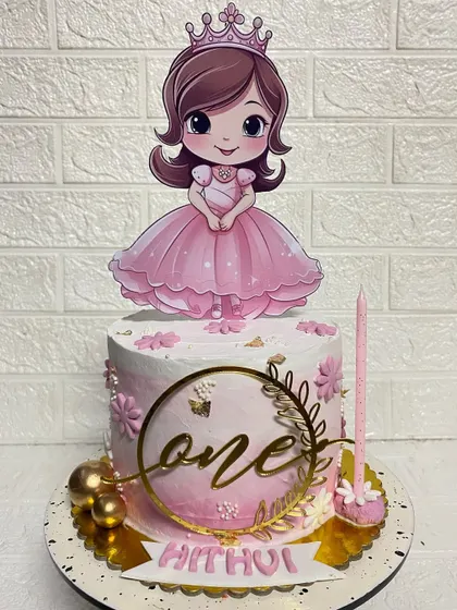 A closer look at the "one" topper and delicate details on our first birthday princess cake.