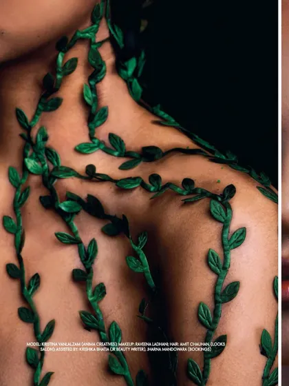 An intimate close-up on the model's shoulder and collarbone, with green felt vines appearing to grow over her skin. This shot emphasizes the tactile, organic nature of the editorial's concept for ELLE India.