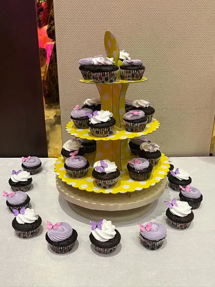 A beautiful tiered display of our butterfly cupcakes, perfect for a party dessert table.