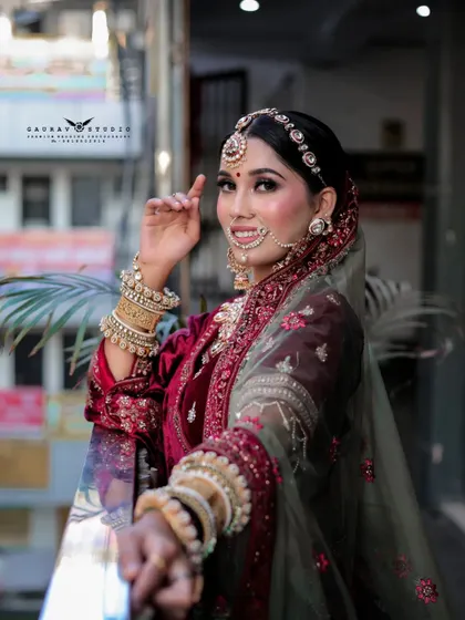 A playful "follow me to" style shot where the bride leads the viewer. This engaging photo showcases her full attire from a unique and interactive perspective.