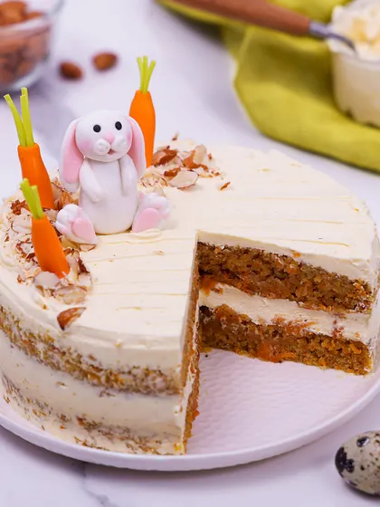 We elevate a classic with our Easter carrot cake. This moist, layered cake is topped with a delightful fondant bunny and carrots, combining timeless flavor with charming, handcrafted decorations for a perfect holiday dessert.
