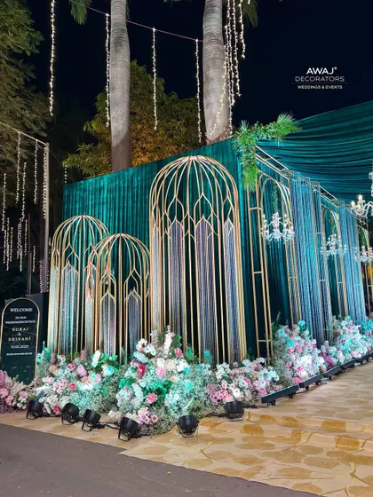 The entrance at night, with dramatic lighting creating a magical and inviting atmosphere.