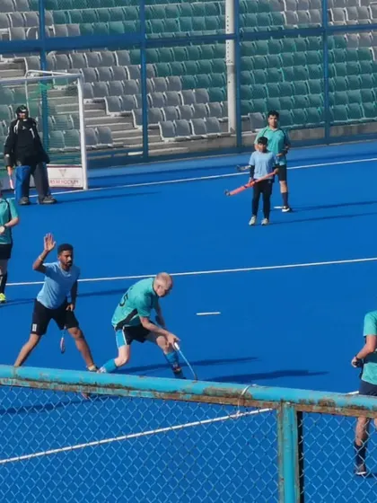A view of the game from the sidelines, showing the intensity of the match between my academy and our rivals.