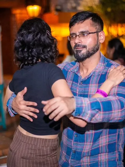 A close Bachata hold. The focus is on the connection and the music.