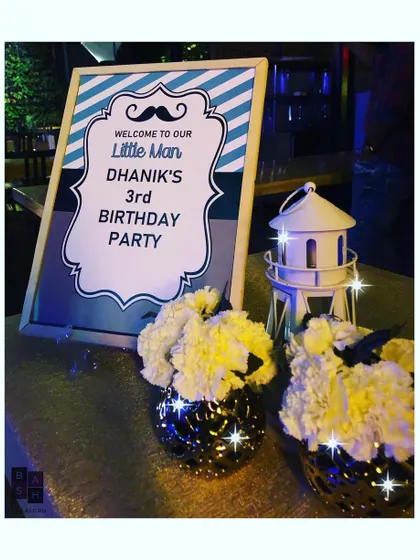 A custom welcome sign for a 'Little Man' themed third birthday party. The sign features a fun mustache graphic and a blue and grey color scheme to greet guests as they arrive.