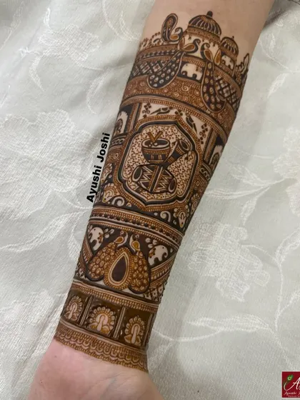 The full bridal arm band, a masterpiece of traditional wedding symbols from top to bottom.