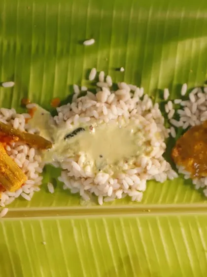 The three mainstays of any Sadya: Sambar, Pulisseri, and a tangy raw mango curry. Pouring these over rice creates a new flavor combination with every bite, a true dance of sweet, sour, and savory notes on the palate.