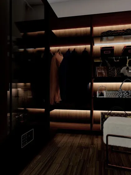 A glimpse into a luxurious walk-in closet design with dark wood and integrated backlighting. This space is designed for organization, with dedicated sections for clothes, bags, and accessories.