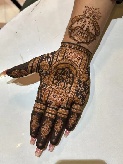 An architectural design inspired by Rajasthani palaces. The intricate arches and jaali work create a sense of grandeur, perfect for a bride who loves traditional art.