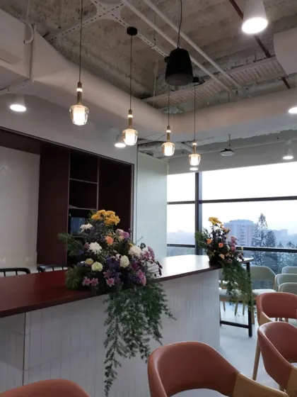 Even functional spaces like a pantry or lounge can be elevated for an event. We placed these tasteful floral arrangements at the Columbia Sportswear office opening to ensure the celebratory atmosphere extended throughout the entire workspace.